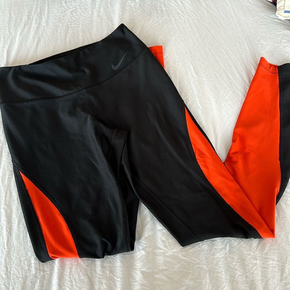 Black and orange Nike leggings